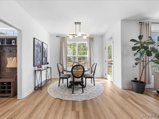 9913 Craftsbury Dr, Midlothian, VA 23112 - dining space with light wood-style flooring and a chandelier