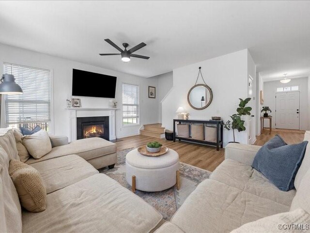 9913 Craftsbury Dr, Midlothian, VA 23112 - living room with ceiling fan, wood finished floors, and a glass covered fireplace