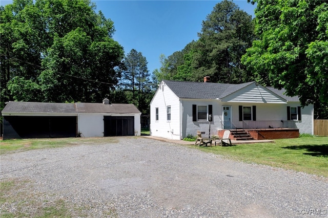 10439 Ashcake Rd, Hanover, VA 23005 - single story home featuring a detached garage, an outdoor structure, covered porch, a front yard, and a shingled roof