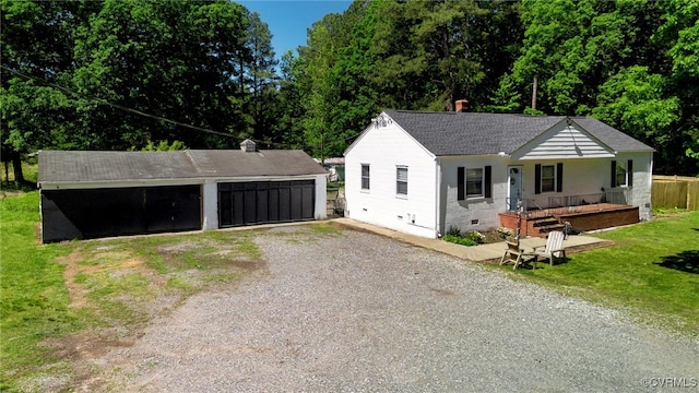 10439 Ashcake Rd, Hanover, VA 23005 - ranch-style house with a garage, an outbuilding, covered porch, a shingled roof, and a front yard