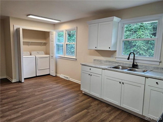 1982 Redd Shop Rd, Farmville, VA 23901 - washroom featuring dark wood finished floors, washing machine and dryer, and plenty of natural light