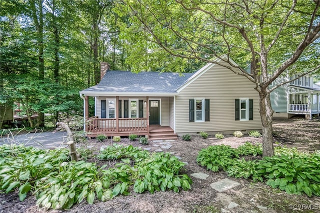 1436 Porters Mill Ter, Chesterfield, VA 23114 - view of front facade featuring covered porch, a shingled roof, a chimney, and crawl space