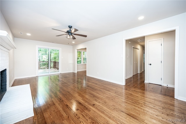 1436 Porters Mill Ter, Chesterfield, VA 23114 - unfurnished living room with a ceiling fan, a fireplace, wood finished floors, and recessed lighting