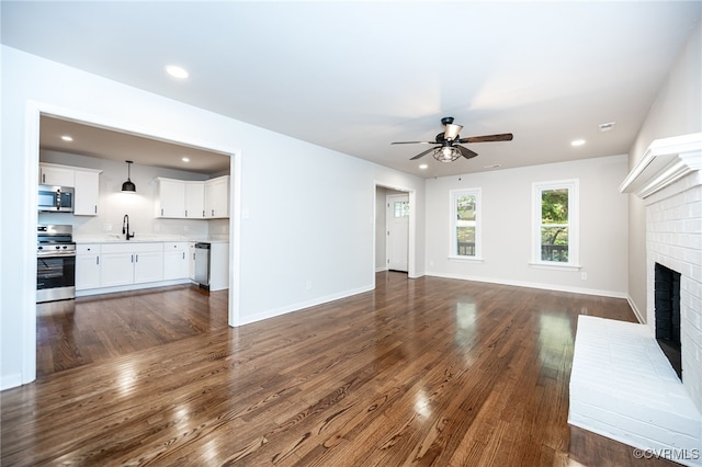 1436 Porters Mill Ter, Chesterfield, VA 23114 - unfurnished living room featuring ceiling fan, dark wood-style flooring, a fireplace, and recessed lighting