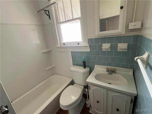 406 N 5th Ave, Hopewell, VA 23860 - bathroom featuring vanity, tile walls, and shower / bathtub combination