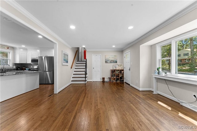 2419 Fon Du Lac Rd, Henrico, VA 23229 - living room featuring stairway, recessed lighting, dark wood finished floors, plenty of natural light, and crown molding