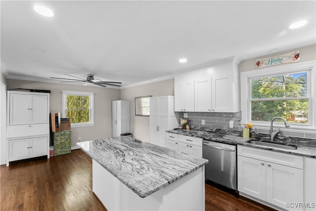2419 Fon Du Lac Rd, Henrico, VA 23229 - kitchen with stainless steel dishwasher, ceiling fan, a kitchen island, light stone countertops, and white cabinets