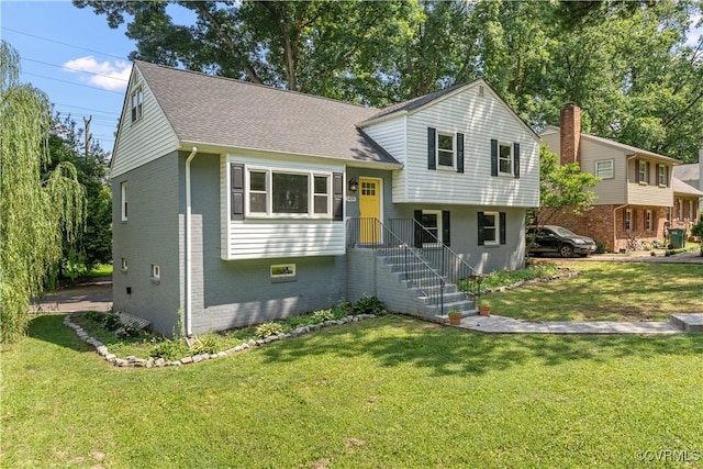 2419 Fon Du Lac Rd, Henrico, VA 23229 - split level home with brick siding, roof with shingles, and a front yard