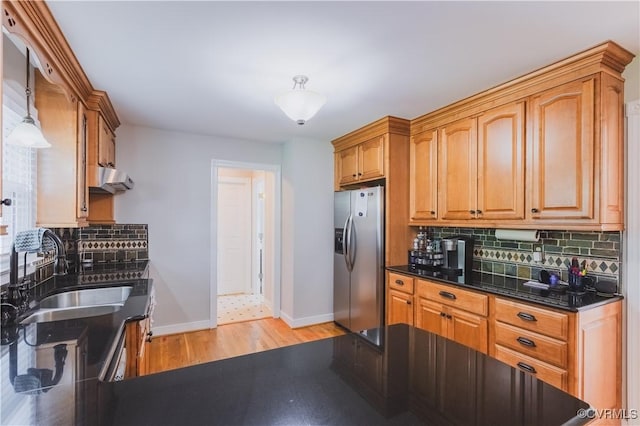 12703 Kelsey Pointe Ct, Chester, VA 23831 - kitchen featuring stainless steel refrigerator with ice dispenser, light wood-type flooring, backsplash, ventilation hood, and brown cabinetry