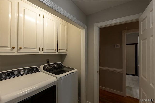 12703 Kelsey Pointe Ct, Chester, VA 23831 - washroom with washing machine and clothes dryer, cabinet space, and dark wood-style floors
