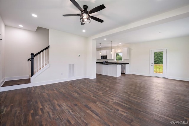 1175 Anderson Hwy, Cumberland, VA 23040 - unfurnished living room with dark wood-style flooring, a ceiling fan, stairs, and recessed lighting