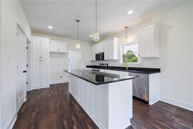 1175 Anderson Hwy, Cumberland, VA 23040 - kitchen with stainless steel appliances, dark countertops, dark wood finished floors, white cabinetry, and recessed lighting