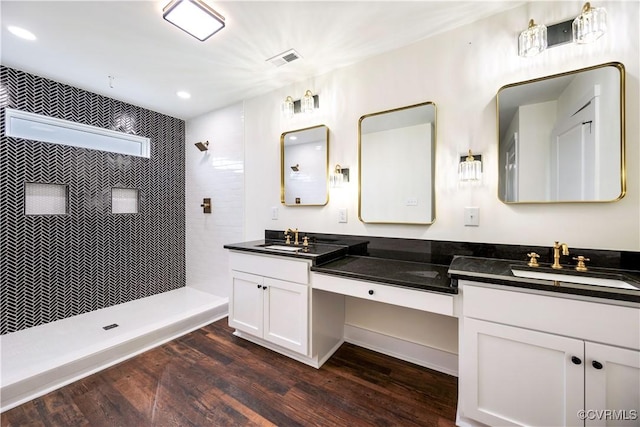 1175 Anderson Hwy, Cumberland, VA 23040 - bathroom featuring double vanity, a walk in shower, wood finished floors, and recessed lighting