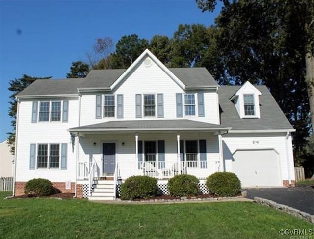7016 Narragansett Ct, Hanover, VA 23111 - colonial inspired home featuring covered porch, asphalt driveway, and a front lawn