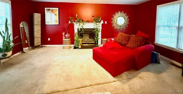 7016 Narragansett Ct, Hanover, VA 23111 - carpeted living room featuring a fireplace with flush hearth and plenty of natural light