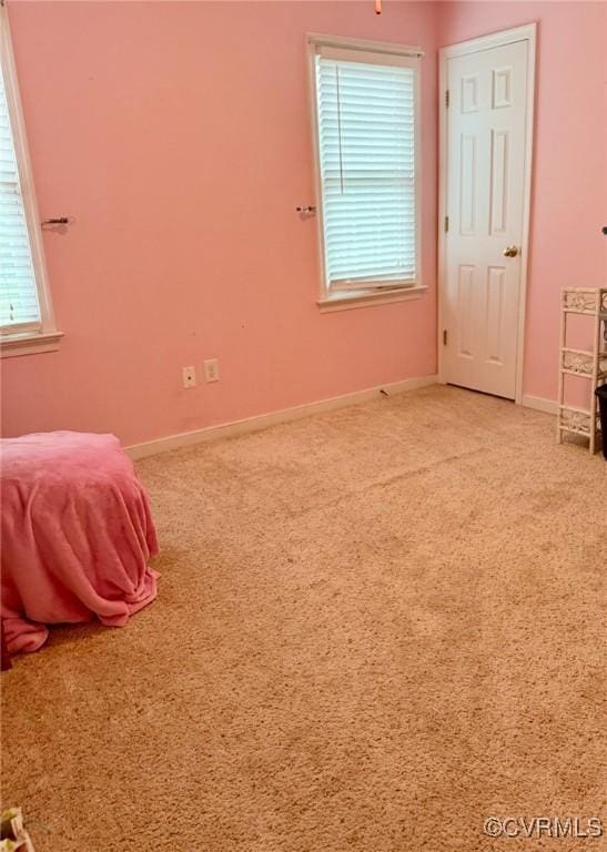 7016 Narragansett Ct, Hanover, VA 23111 - unfurnished bedroom with multiple windows and light colored carpet