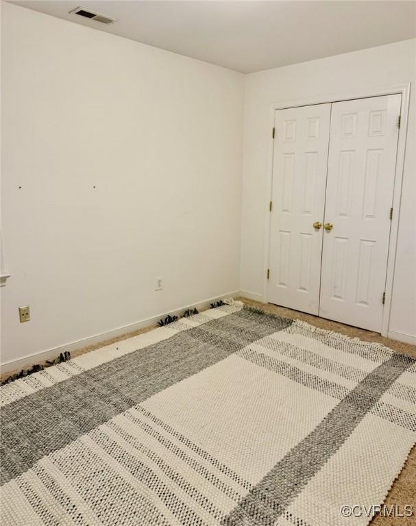7016 Narragansett Ct, Hanover, VA 23111 - unfurnished bedroom with baseboards and a closet