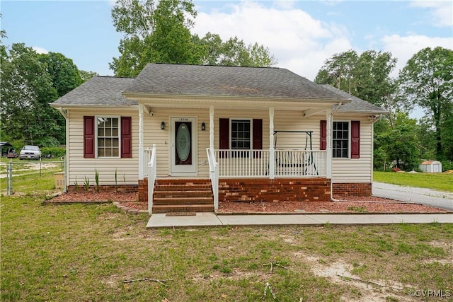 12226 Bristle Cone Ln, Ruther Glen, VA 22546 - view of front of home with a porch and a shingled roof