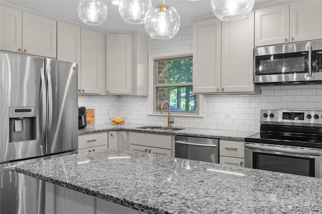 1101 Clearlake Rd, Chesterfield, VA 23236 - kitchen featuring stainless steel appliances, light stone counters, and tasteful backsplash