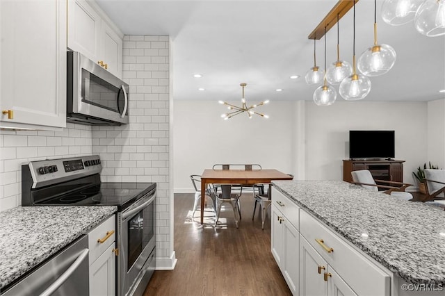 1101 Clearlake Rd, Chesterfield, VA 23236 - kitchen with appliances with stainless steel finishes, tasteful backsplash, dark wood-type flooring, white cabinetry, and light stone counters
