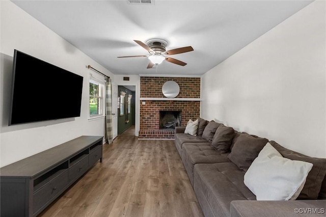 1101 Clearlake Rd, Chesterfield, VA 23236 - living room featuring ceiling fan, light wood-style flooring, and a fireplace