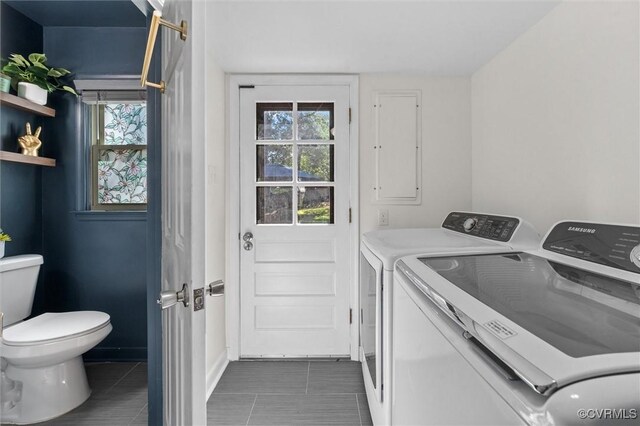 1101 Clearlake Rd, Chesterfield, VA 23236 - washroom featuring washer and clothes dryer, dark tile patterned floors, and healthy amount of natural light