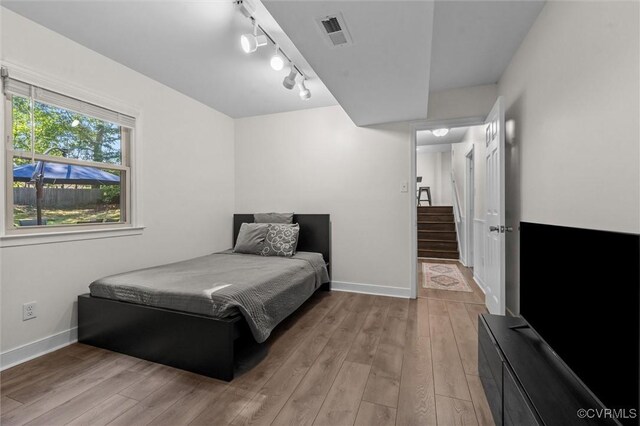 1101 Clearlake Rd, Chesterfield, VA 23236 - bedroom with light wood finished floors and rail lighting
