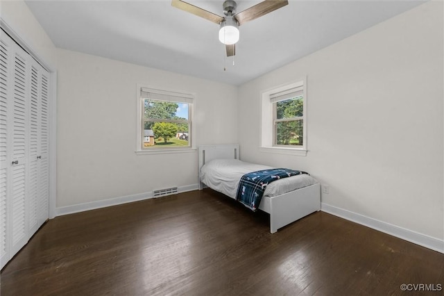 1101 Clearlake Rd, Chesterfield, VA 23236 - unfurnished bedroom featuring multiple windows, wood finished floors, a closet, and a ceiling fan