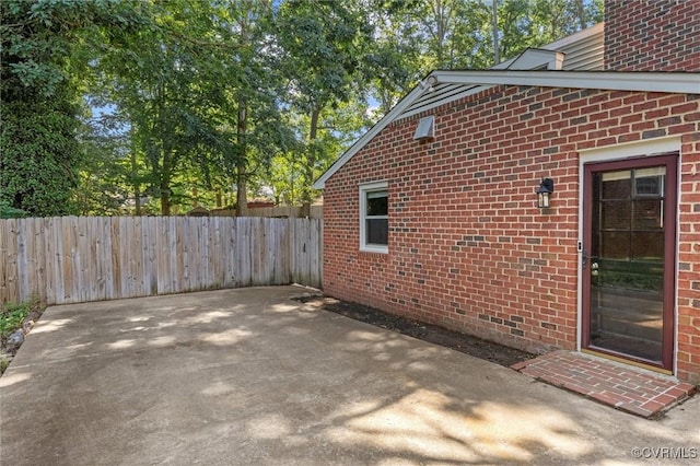 1101 Clearlake Rd, Chesterfield, VA 23236 - view of side of property with brick siding and a patio area