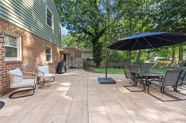 1101 Clearlake Rd, Chesterfield, VA 23236 - fenced backyard with a patio area, a gate, outdoor dining space, and area for grilling