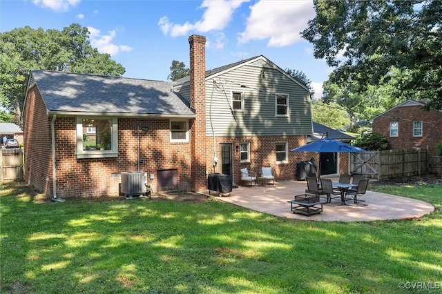 1101 Clearlake Rd, Chesterfield, VA 23236 - rear view of house featuring a patio area, brick siding, a fenced backyard, a chimney, and roof with shingles