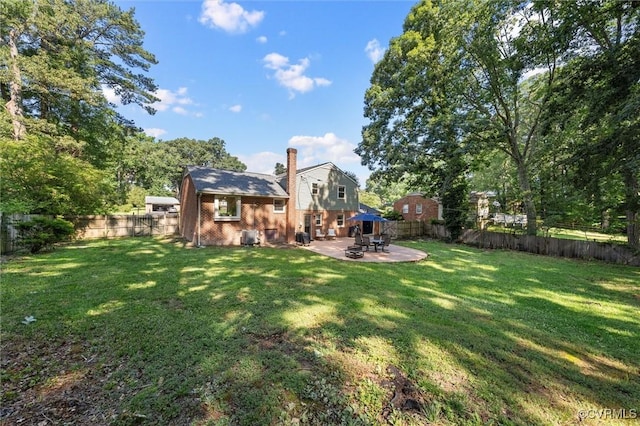 1101 Clearlake Rd, Chesterfield, VA 23236 - back of house with a patio, brick siding, a fenced backyard, and a chimney
