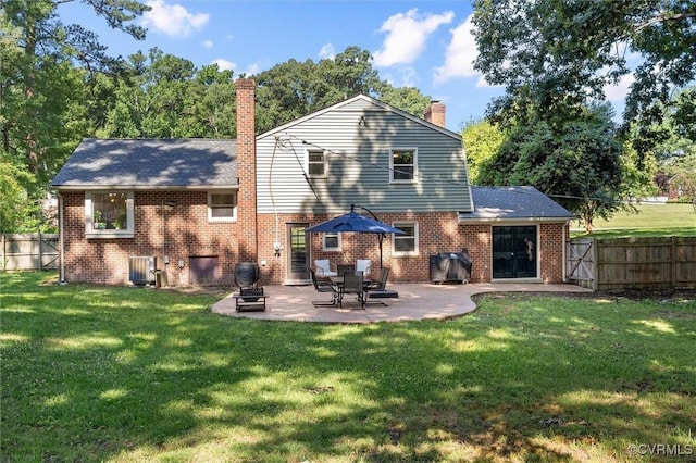1101 Clearlake Rd, Chesterfield, VA 23236 - rear view of house with a chimney, a fenced backyard, brick siding, and a patio