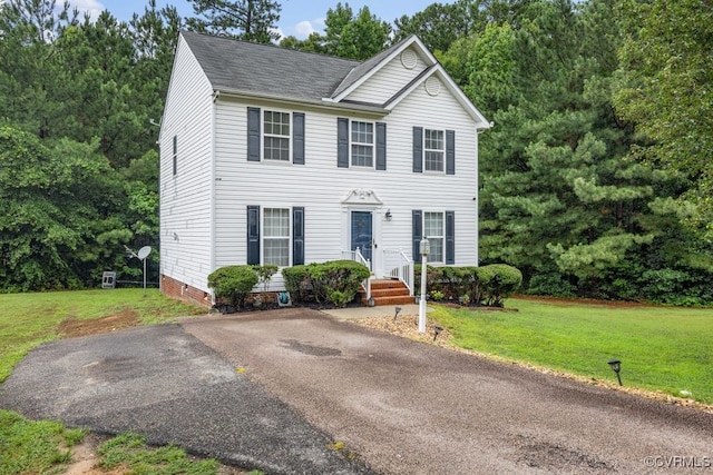 225 Scotch Pine Dr, Sandston, VA 23150 - colonial-style house with a front yard and a shingled roof