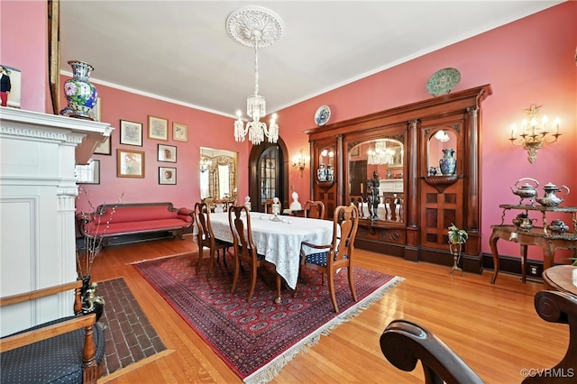 241 S Sycamore St, Petersburg, VA 23803 - dining space featuring wood finished floors, a chandelier, and ornamental molding