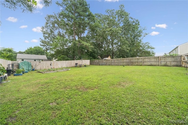 1403 Miles Ave, Hopewell, VA 23860 - fenced backyard featuring a garden