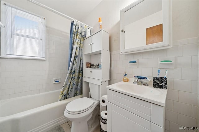 1403 Miles Ave, Hopewell, VA 23860 - full bath with vanity, tile walls, shower / bathtub combination with curtain, and wainscoting