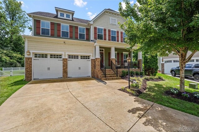 3057 Hunton Cottage Ln, Glen Allen, VA 23059 - craftsman inspired home featuring covered porch, concrete driveway, a garage, and brick siding
