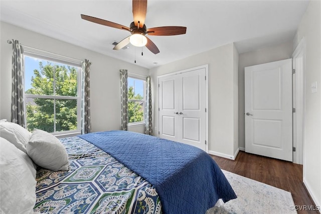 3057 Hunton Cottage Ln, Glen Allen, VA 23059 - bedroom with wood finished floors, multiple windows, and a closet