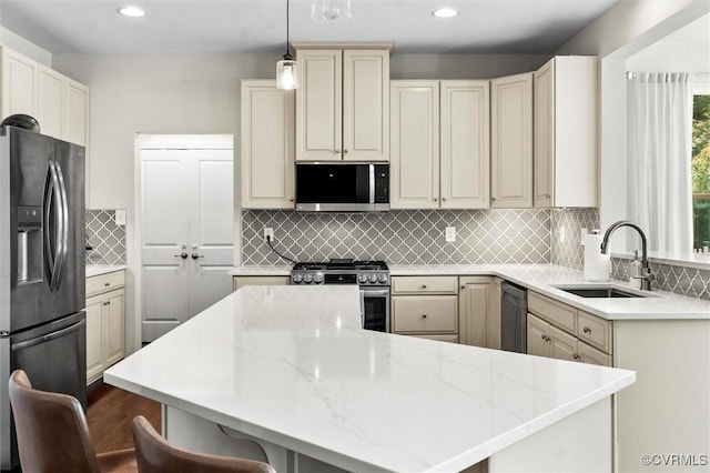 3057 Hunton Cottage Ln, Glen Allen, VA 23059 - kitchen featuring stainless steel appliances, a kitchen bar, recessed lighting, decorative backsplash, and light stone countertops