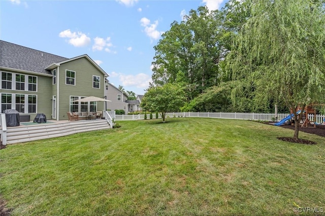 3057 Hunton Cottage Ln, Glen Allen, VA 23059 - fenced backyard featuring a playground and a wooden deck