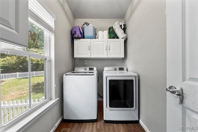 3057 Hunton Cottage Ln, Glen Allen, VA 23059 - washroom featuring cabinet space, washer and clothes dryer, and dark wood-style flooring