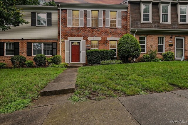 1593 Constitution Dr, Henrico, VA 23238 - townhome / multi-family property with a front lawn and brick siding