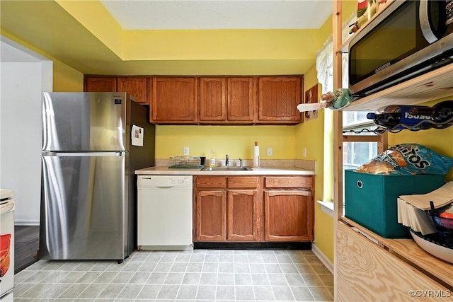 1593 Constitution Dr, Henrico, VA 23238 - kitchen featuring appliances with stainless steel finishes, light countertops, and brown cabinets