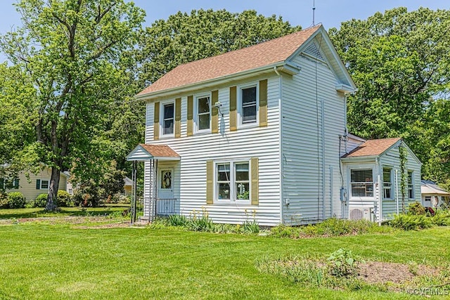 2165 Windmill Point Rd, White Stone, VA 22578 - view of front of home featuring a front yard and roof with shingles