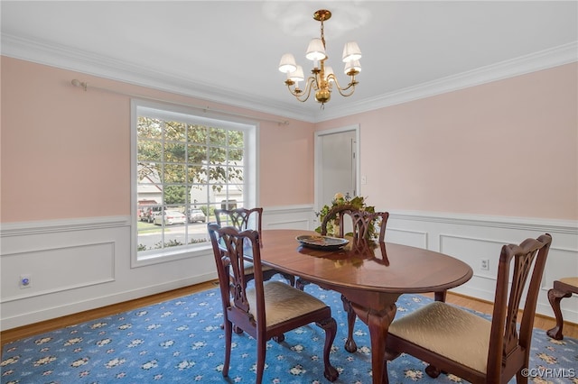 1406 Walton Bluff Ter, Midlothian, VA 23114 - dining space featuring a chandelier, ornamental molding, a wainscoted wall, and wood finished floors