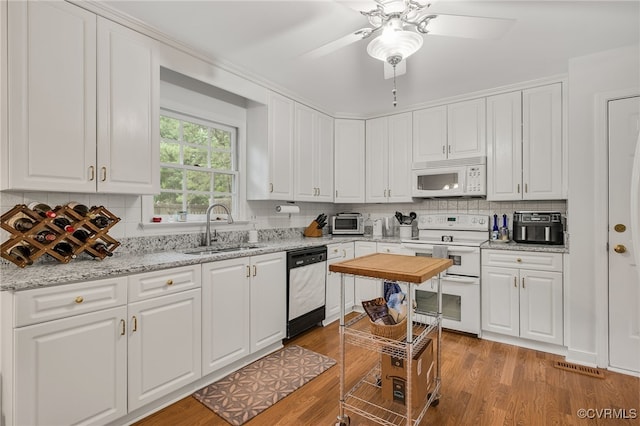 1406 Walton Bluff Ter, Midlothian, VA 23114 - kitchen featuring white appliances, white cabinets, tasteful backsplash, light wood finished floors, and ceiling fan