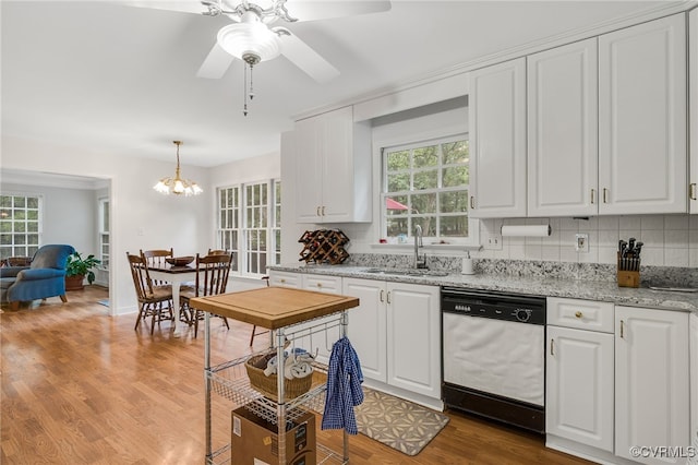 1406 Walton Bluff Ter, Midlothian, VA 23114 - kitchen with white dishwasher, tasteful backsplash, and white cabinetry