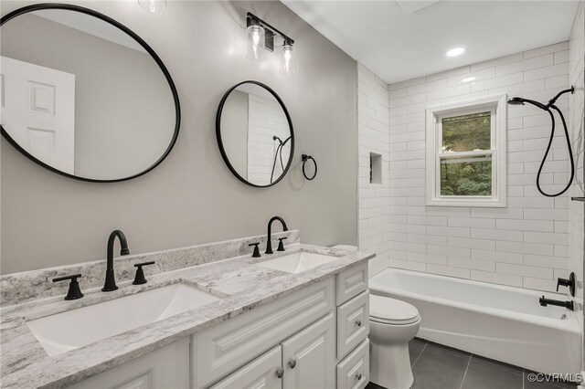 4712 Kyloe Ln, Moseley, VA 23120 - bathroom featuring tile patterned floors, double vanity, and shower / tub combination