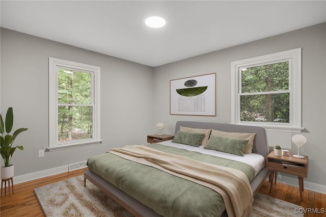 4712 Kyloe Ln, Moseley, VA 23120 - bedroom with multiple windows and wood finished floors